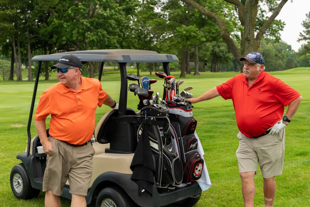Participants enjoying a round of golf at the Make-A-Wish Wisconsin Golf Outing in Appleton, WI, captured in joyful moments.