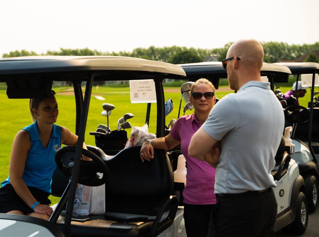 Golfers participating in the SOAR Fox Cities Golf Outing, an event dedicated to empowering people with differing abilities.